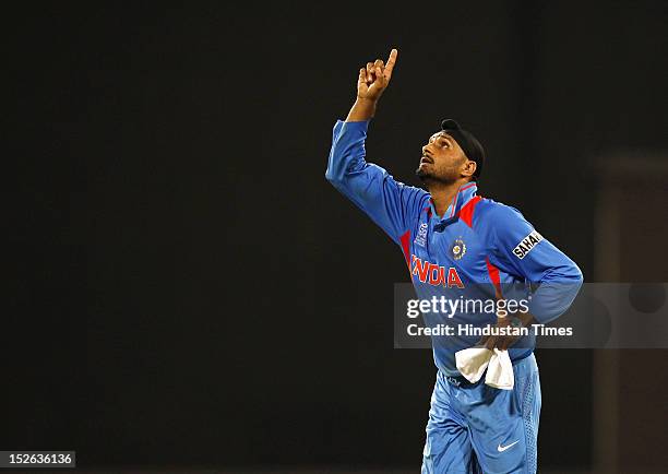 Indian bowler Harbhajan Singh celebrates after he took four wickets during the ICC T20 World Cup cricket match between India and England at R....