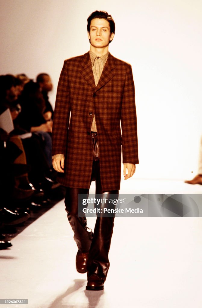 Mossimo Model A model walks the runway in the Mossimo Menswear Fall 1997 Ready to ...