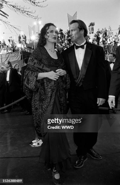 Andie MacDowell and Paul Qualley attend an event at the Shrine Auditorium in Los Angeles, California, on March 27, 1995.