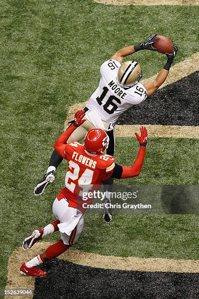 Lance Moore of the New Orleans Saints catches a touchdown pass over Brandon Flowers of the Kansas City Chiefs at the Mercedes-Benz Superdome on...