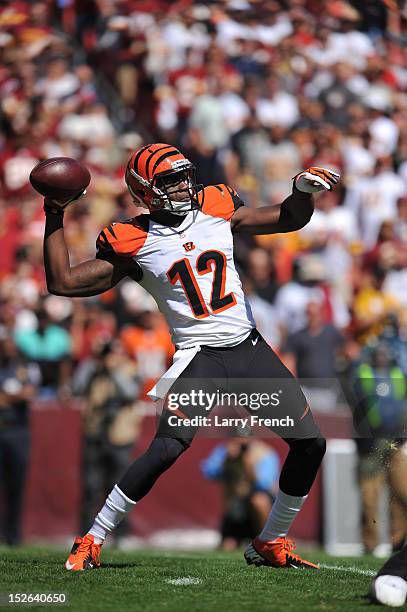 Mohamed Sanu of the Cincinnati Bengals throws a pass for the first touchdown of the game against the Washington Redskins at FedExField on September...