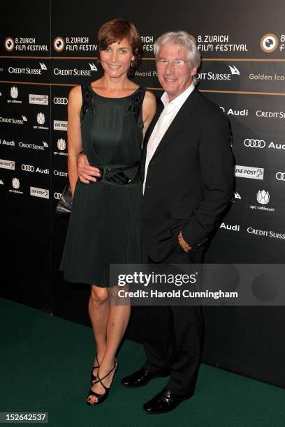 Richard Gere and his wife Carey Lowell pose during the "Arbitrage" premiere as part of the Zurich Film Festival 2012 on September 23, 2012 in Zurich,...