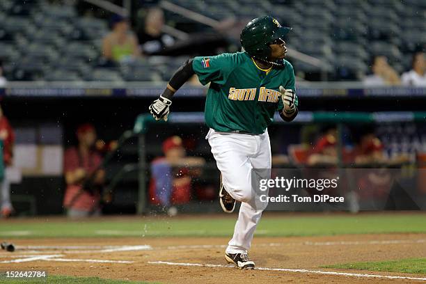 Gift Ngoepe of Team South Africa runs to first base during game 5 of the Qualifying Round of the World Baseball Classic at Roger Dean Stadium against...