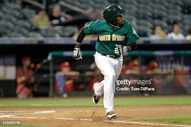 Gift Ngoepe of Team South Africa runs to first base during game 5 of the Qualifying Round of the World Baseball Classic at Roger Dean Stadium against...
