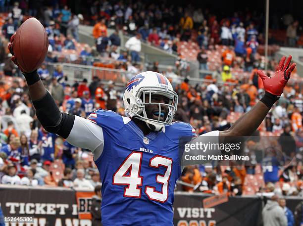 Linebacker Bryan Scott of the Buffalo Bills celebrates after scoring a touchdown off an interception against the Cleveland Browns at Cleveland Browns...