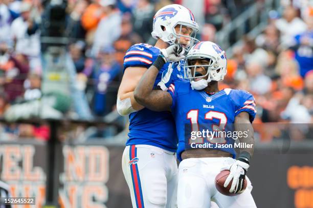 Tight end Scott Chandler celebrates with wide receiver Steve Johnson of the Buffalo Bills after Johnson scored a touchdown during the second half...