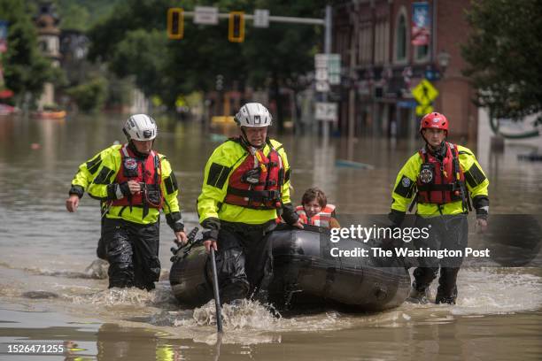 Members of the Colchester Technical Rescue team respond to a call to evacuate two adults and an infant from their downtown Montpelier, Vermont...