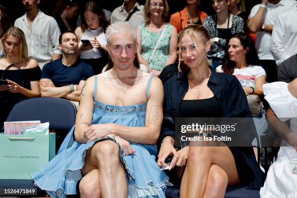 Guests at the Marcel Ostertag fashion show during the W.E4. Fashion Day as part of Berlin Fashion Week SS24 at Verti Music Hall on July 11, 2023 in...