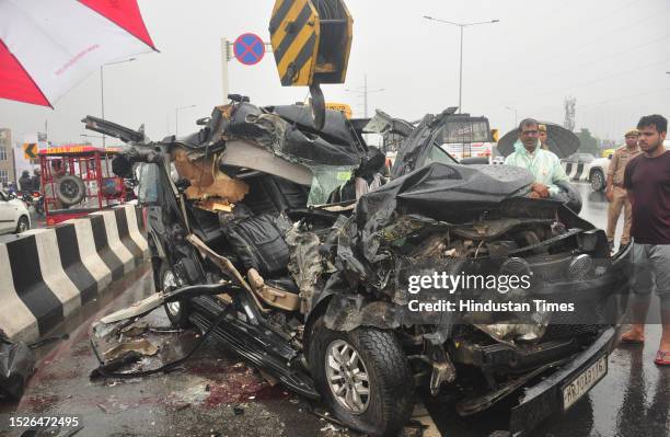 Ghaziabad, India - July 11 2023: Ghaziabad Police and and others Person near the wreckage of a car after a head-on collision with a bus on in which...