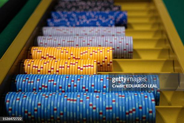 Gambling chips sit in a tray during the Global Gaming Expo Asia at a casino in Macau on July 12, 2023.