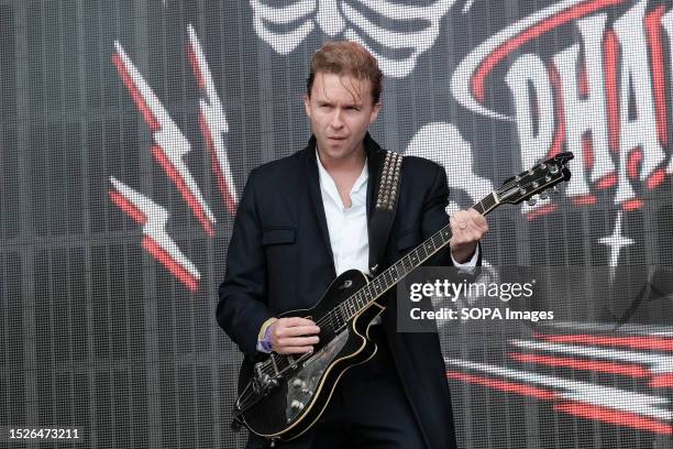 Andy Halligan, guitarist with British Rockabilly band Furious, playing guitar for Slim Jim Phantom, performing live on stage at Let's Rock 1980s...