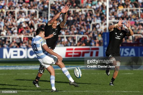 Santiago Carreras of Argentina kicks the ball against Shannon Frizell of New Zealand during a Rugby Championship match between Argentina Pumas and...