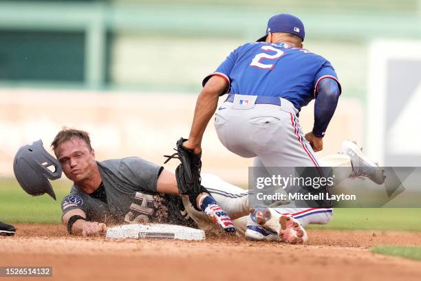 Marcus Semien of the Texas Rangers tags out Alex Call of the Washington Nationals trying to steal second base in the sixth inning during a baseball...