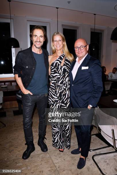 Thomas Hayo, Andre Maeder and guest attend the Vogue X KaDeWe X FCG Summer Night & Fashion Party at KaDeWe on July 11, 2023 in Berlin, Germany.