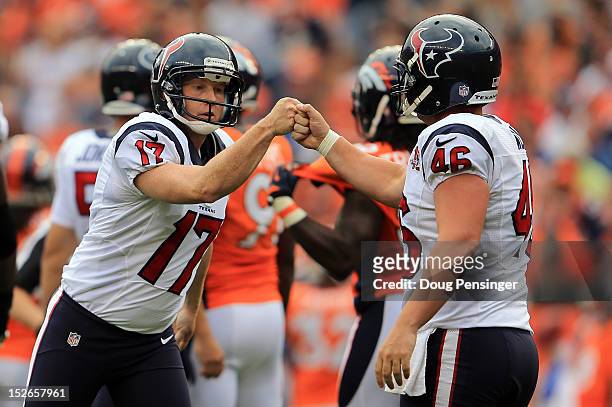 Place kicker Shayne Graham of the Houston Texans celebrates his 41 yard field goal against the Denver Broncos with long snapper Jon Weeks of the...
