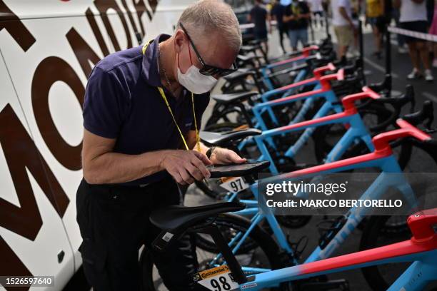 Official performs a technical control on AG2R Citroen Team bicycles before the start of the 11th stage of the 110th edition of the Tour de France...