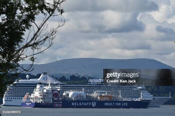 The LPG tanker JS Ineos Intuition passes the Oceania cruise ship Riviera at anchor off the Forth Bridge, with the UK cruising season in full swing,...