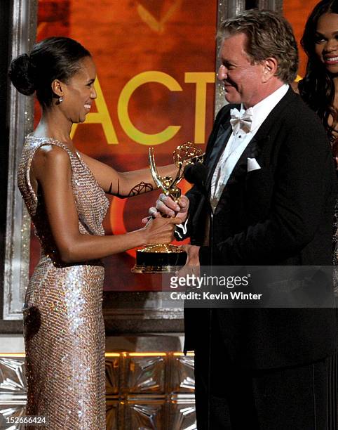 Actor Tom Berenger accepts Outstanding Supporting Actor in a Miniseries or a Movie for "Hatfields & McCoys" from actress Kerry Washington onstage...