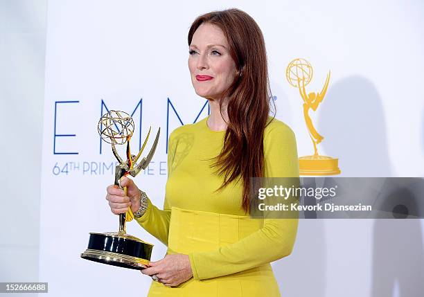 Actress Julianne Moore, winner Outstanding Lead Actress in a Miniseries or a Movie for "Game Change," poses in the press room during the 64th Annual...