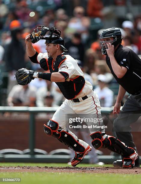 Eli Whiteside of the San Francisco Giants chases a bunt against the San Diego Padres during the game at AT&T Park on Sunday, September 23, 2012 in...