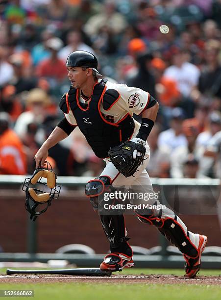 Eli Whiteside of the San Francisco Giants chases a bunt against the San Diego Padres during the game at AT&T Park on Sunday, September 23, 2012 in...