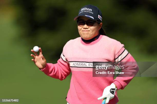 Nasa Hataoka of Japan waves after making a birdie on the 16th green during the third round of the 78th U.S. Women's Open at Pebble Beach Golf Links...