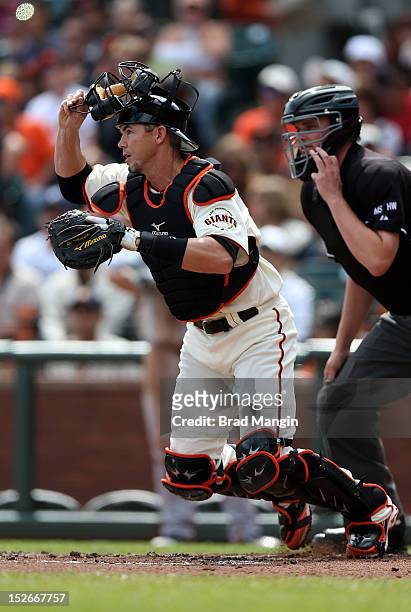 Eli Whiteside of the San Francisco Giants chases a bunt against the San Diego Padres during the game at AT&T Park on Sunday, September 23, 2012 in...
