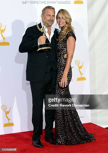 Actor Kevin Costner, winner Outstanding Lead Actor in a Miniseries or a Movie for "Hatfields & McCoys," poses in the press room with wife Christine...