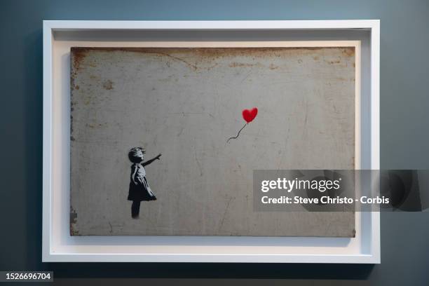 The painting Girl with Ballon by Banksy in the exhibition Modern Masters at the Moco Museum in Amsterdam, on August 26 in Sydney, Australia.