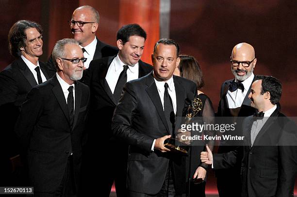 Producers Tom Hanks , Jay Roach , Gary Goetzman accept Outstanding Miniseries or TV Movie award for "Game Change" onstage during the 64th Annual...