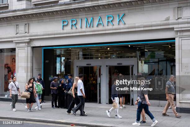 Shoppers and visitors out on Oxford Street pass Primark on 9th July 2023 in London, United Kingdom. Oxford Street is a major retail centre in the...