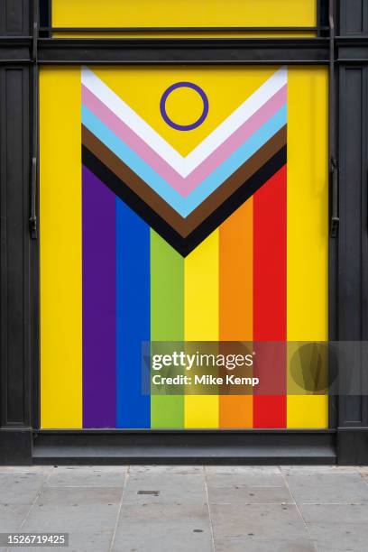 Intersex-inclusive Progress Pride flag is seen in an empty shop window on 9th July 2023 in London, United Kingdom. The flag includes the rainbow flag...