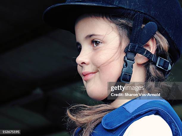 girl wearing equestrian riding hat - riding hat fotografías e imágenes de stock