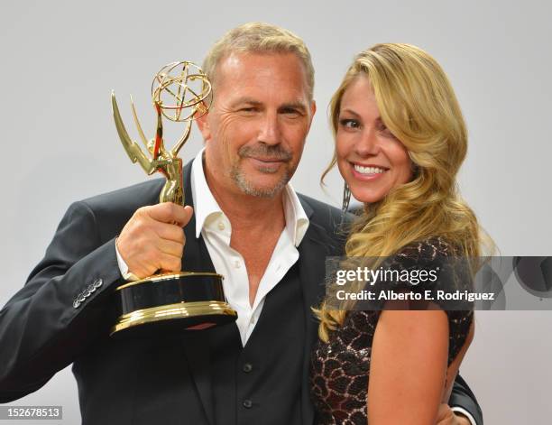 Actor Kevin Costner and wife Chistine Baumgartner pose in the 64th Annual Emmy Awards press room at Nokia Theatre L.A. Live on September 23, 2012 in...