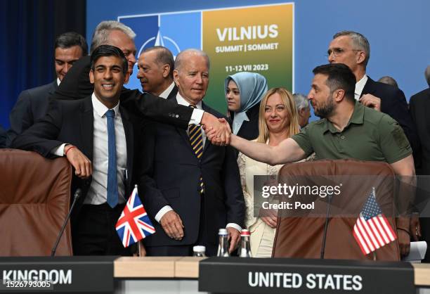 Ukraine's President Volodymyr Zelensky shakes hands with Lithuania's President Gitanas Nauseda next to Spain's Prime Minister Pedro Sanchez, Turkey's...