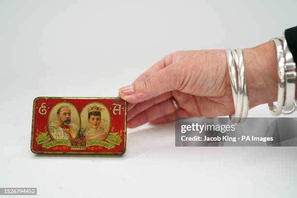 Tin containing Cadbury's chocolates, made to celebrate the coronation of King Edward VII and Queen Alexandra on June 26 before they go up for sale by...