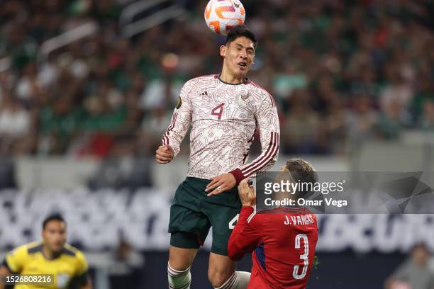 Edson Alvarez Mexico jumps for a header over Juan Pablo Vargas of Costa Rica during the quarterfinal match between Mexico and Costa Rica as part of...
