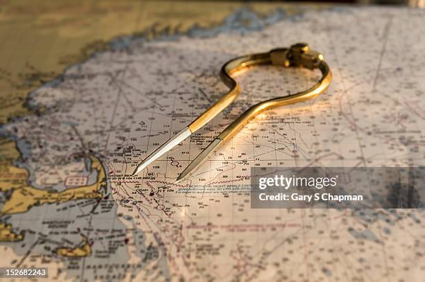 dividers on maine coastal chart, map - drawing compass fotografías e imágenes de stock