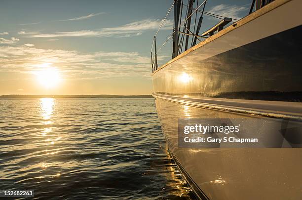 bow of 62 ft sailboat at sunset - hull ストックフォトと画像