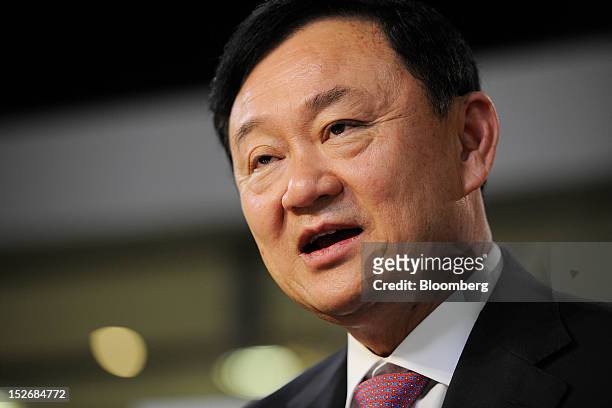 Thaksin Shinawatra, former prime minister of Thailand, speaks during an interview in Singapore, on Monday, Sept. 24, 2012. Thaksin said a...