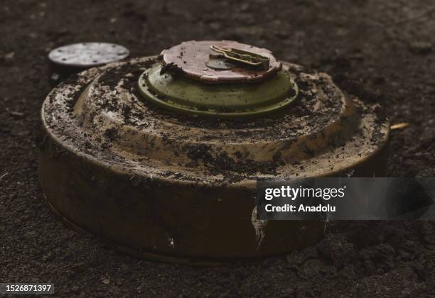 Ukrainian army's 35th Marine Brigade members conduct mine clearance work at a field in Donetsk, Ukraine on July 11, 2023. The Engineer Group of the...