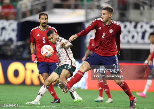 Orbelin Pineda of Mexico is marked by Juan Pablo Vargas of Costa Rica during the quarterfinal match between Mexico and Costa Rica as part of 2023...