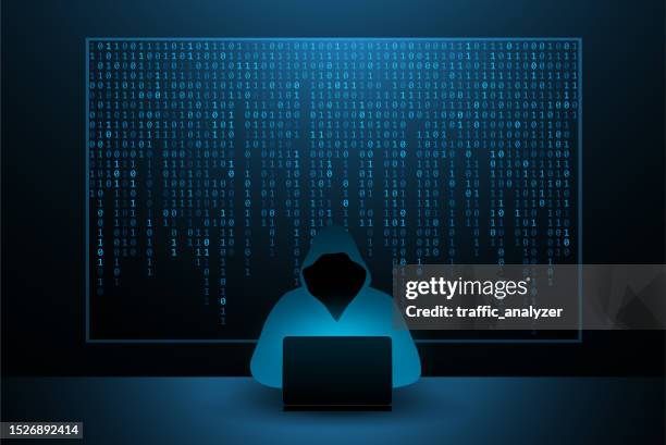 hacker in a hoodie - laptop dark background stock illustrations
