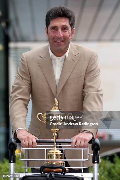 Team Captain Jose Maria Olazabal poses with the Ryder Cup as the Europe team depart for the Ryder Cup from Heathrow Airport on September 24, 2012 in...