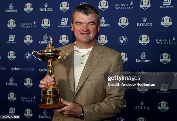 Paul Lawrie of Scotland poses with the Ryder cup as the Europe team depart for the Ryder Cup from Heathrow Airport on September 24, 2012 in London,...