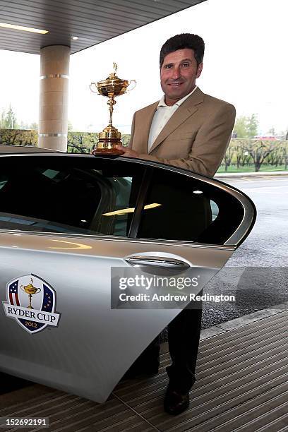 Team Captain Jose Maria Olazabal poses with the Ryder Cup as the Europe team depart for the Ryder Cup from Heathrow Airport on September 24, 2012 in...