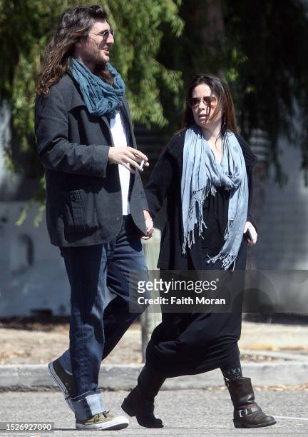 Holly Marie Combs and Josh Cocktail arrive at Perth Airport on March 27, 2014 in Perth, Australia.