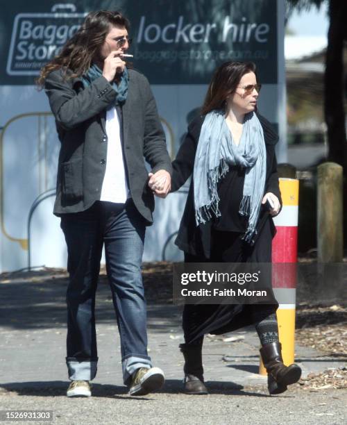 Holly Marie Combs and Josh Cocktail arrive at Perth Airport on March 27, 2014 in Perth, Australia.