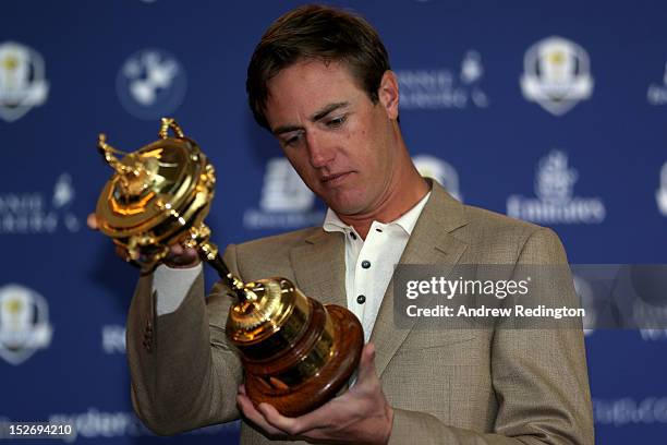 Nicolas Colsaerts of Belgium poses with the Ryder cup as the Europe team depart for the Ryder Cup from Heathrow Airport on September 24, 2012 in...