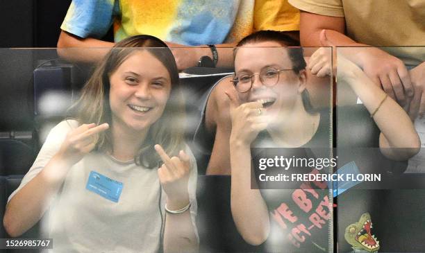 Swedish climate campaigner Greta Thunberg gestures as she attends a voting session on EU nature restoration law during a plenary session at the...